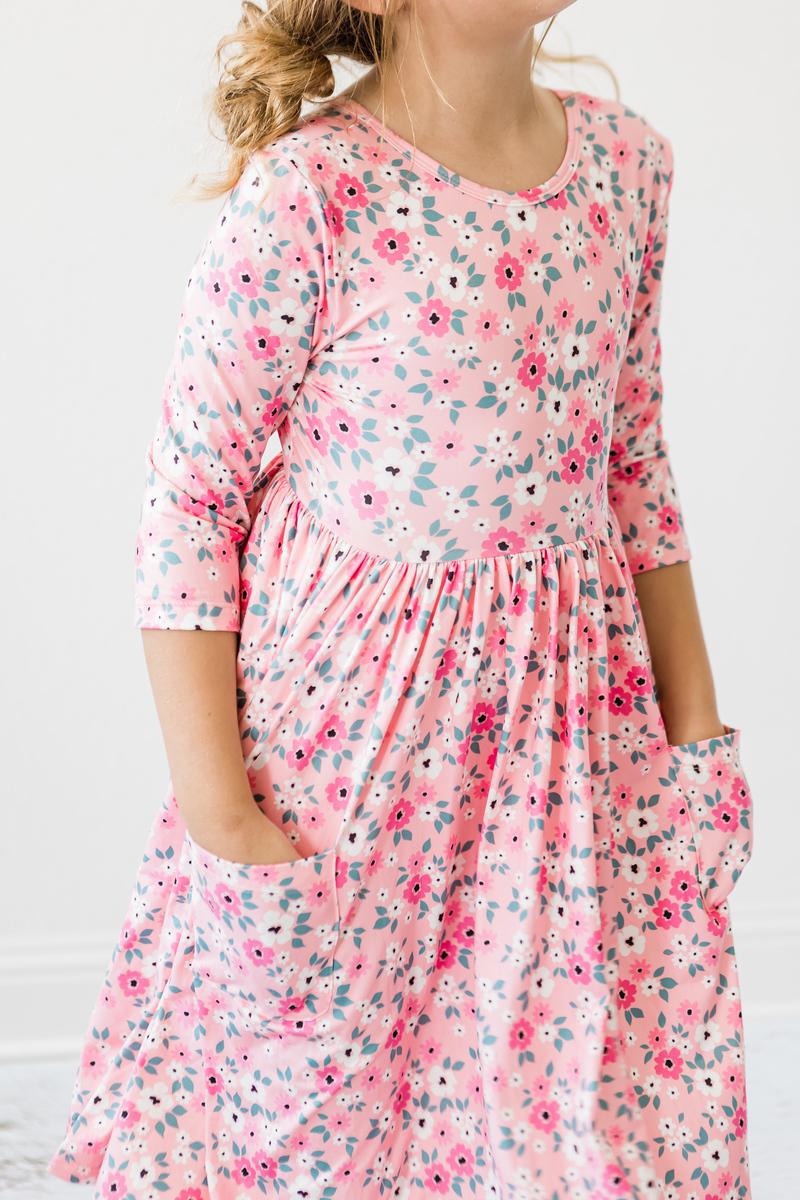 Child wearing the Azalea pocket twirl dress